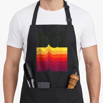 Tablier de cuisine noir avec inscription 1982 et motifs ondulés colorés jaune orange rose rouge violet