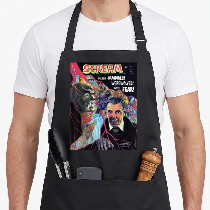 Tablier de cuisine noir avec reproduction d'une couverture de comic book horreur vintage montrant un loup-garou et un vampire.