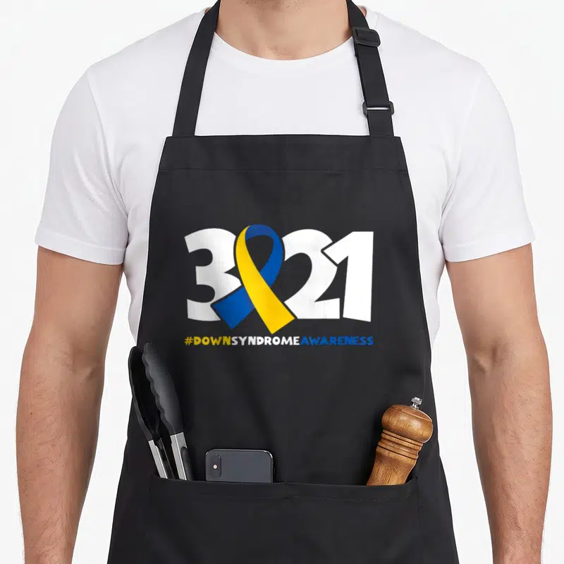 Tablier de cuisine noir avec l'inscription 321 et un ruban bleu et jaune symbolisant la sensibilisation.