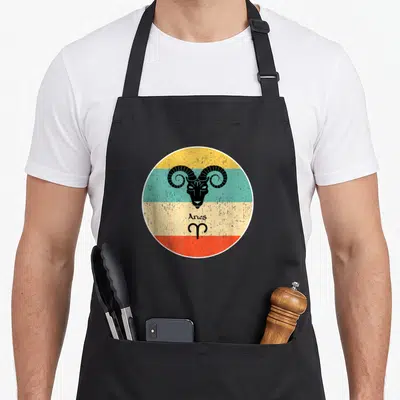 Tablier de cuisine noir avec motif circulaire Bélier Aries couleurs pastel style rétro