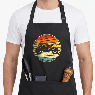 Tablier de cuisine noir avec illustration circulaire moto rétro sunset rayée orange jaune vert turquoise style années 70 80
