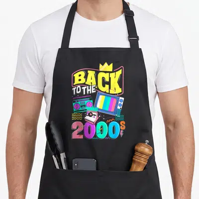 Tablier de cuisine noir avec illustration colorée Back to the 2000s, boombox et télévision rétro.