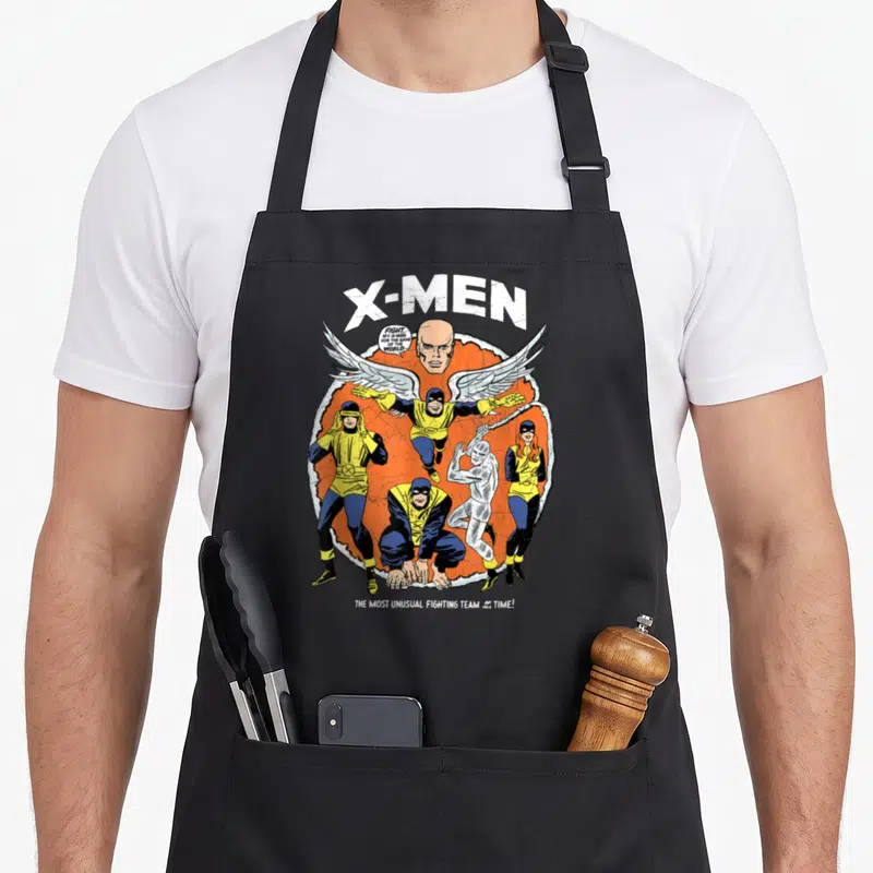 Tablier de cuisine noir avec illustration rétro des X-Men et le texte « Fight my X-Men for the sake of the world ».