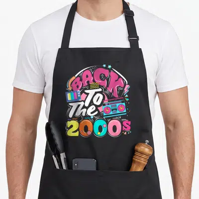 Tablier de cuisine noir avec illustration colorée Back to the 2000s et boombox bleue.