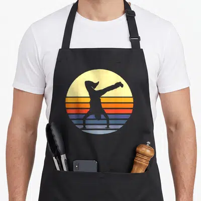 Tablier de cuisine noir avec silhouette B-Boy breakdance sur fond de soleil rétro multicolore