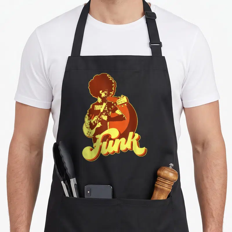 Tablier de cuisine noir avec illustration d'un guitariste funk à l'afro et le mot Funk en lettres jaunes.