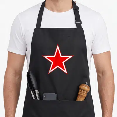 Tablier de cuisine noir avec une grande étoile rouge à contour blanc évoquant l'héritage militaire soviétique.