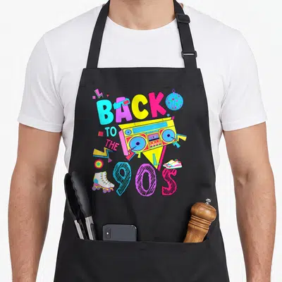 Tablier de cuisine noir avec illustration colorée Back to the 90's incluant une radio et des patins.