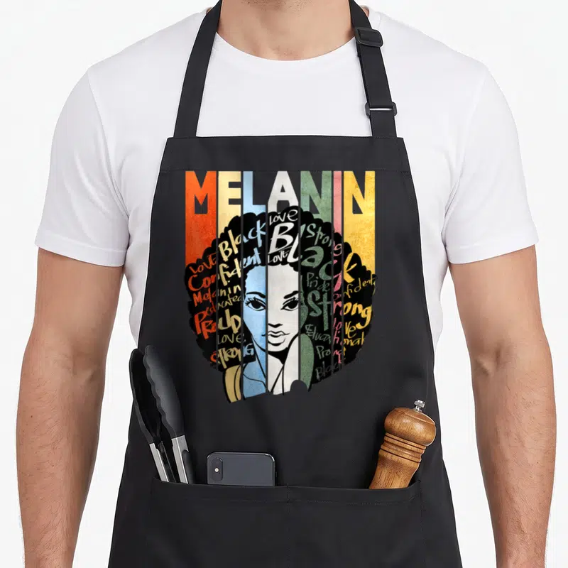 Tablier de cuisine noir avec illustration Melanin Queen Afro femme noire et mots positifs colorés en style vintage.