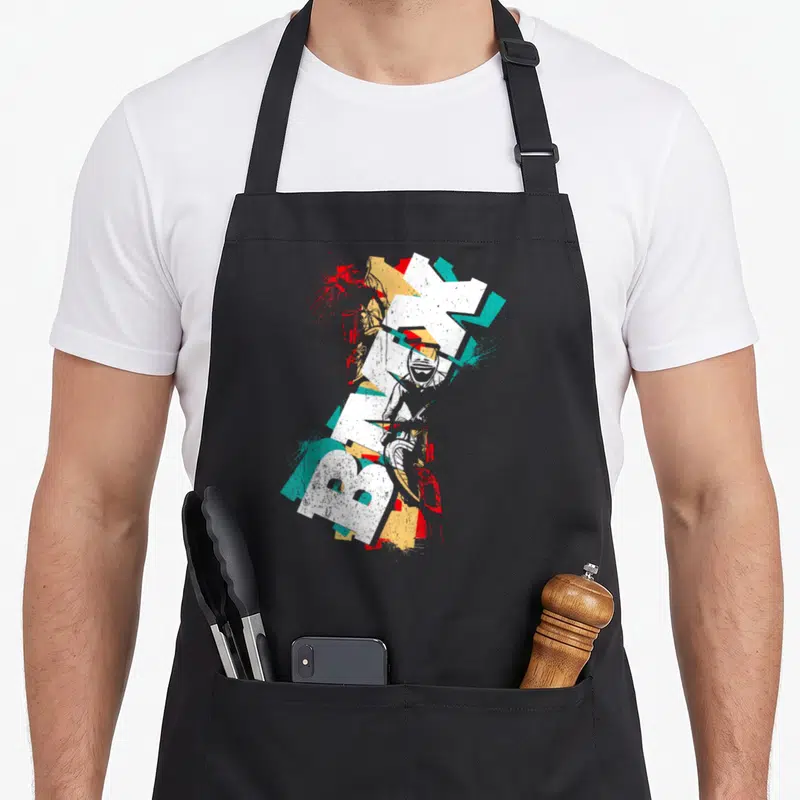 Tablier de cuisine noir avec motif BMX cool rétro et style graffiti coloré.