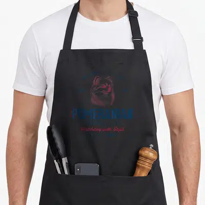 Tablier de cuisine noir avec illustration d'un loulou de Poméranie aux couleurs bleu marine et rose rouge.