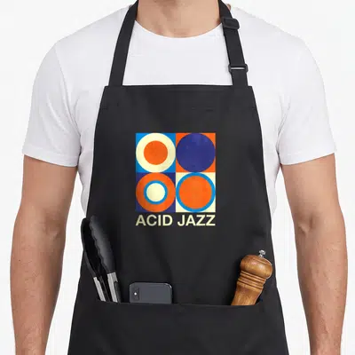 Tablier de cuisine noir avec motif géométrique aux cercles orange bleu et texte ACID JAZZ en bas.
