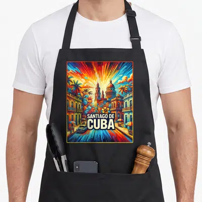 Tablier de cuisine noir avec illustration colorée de Santiago de Cuba montrant une cathédrale et une voiture américaine.