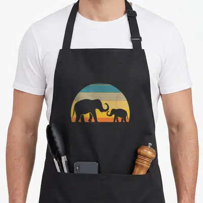 Tablier de cuisine noir avec illustration d'éléphants et sunset rétro aux couleurs pastel