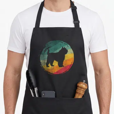 Tablier de cuisine noir avec silhouette de chien Bouvier des Flandres sur fond circulaire coloré style rétro