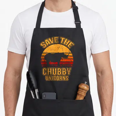 Tablier de cuisine noir avec silhouette de rhinocéros et texte Save The Chubby Unicorns style rétro.