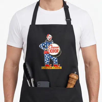 Tablier de cuisine noir avec illustration d'un clown bleu polka holding un tambour Circus Liquor
