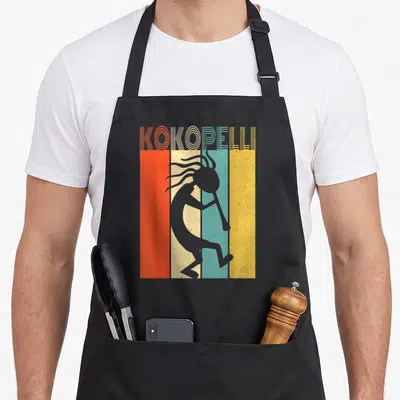 Tablier de cuisine noir avec illustration retro Kokopelli joueur de flûte sur fond à bandes colorées orange crème turquoise et jaune