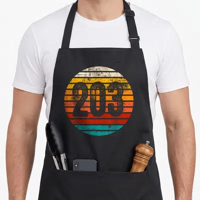 Tablier de cuisine noir avec motif circulaire 203 aux bandes orange et turquoise style sunset.