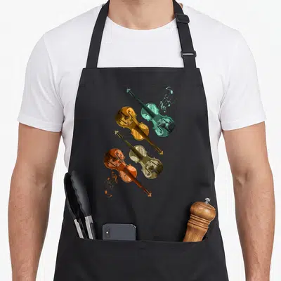 Tablier de cuisine noir avec quatre violons stylisés aux couleurs distinctes et notes de musique volantes.