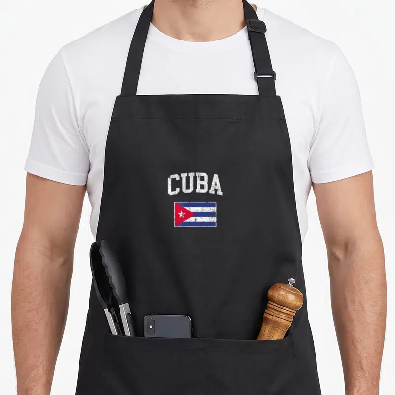 Tablier de cuisine noir avec l'inscription CUBA et le drapeau cubain en style vintage.