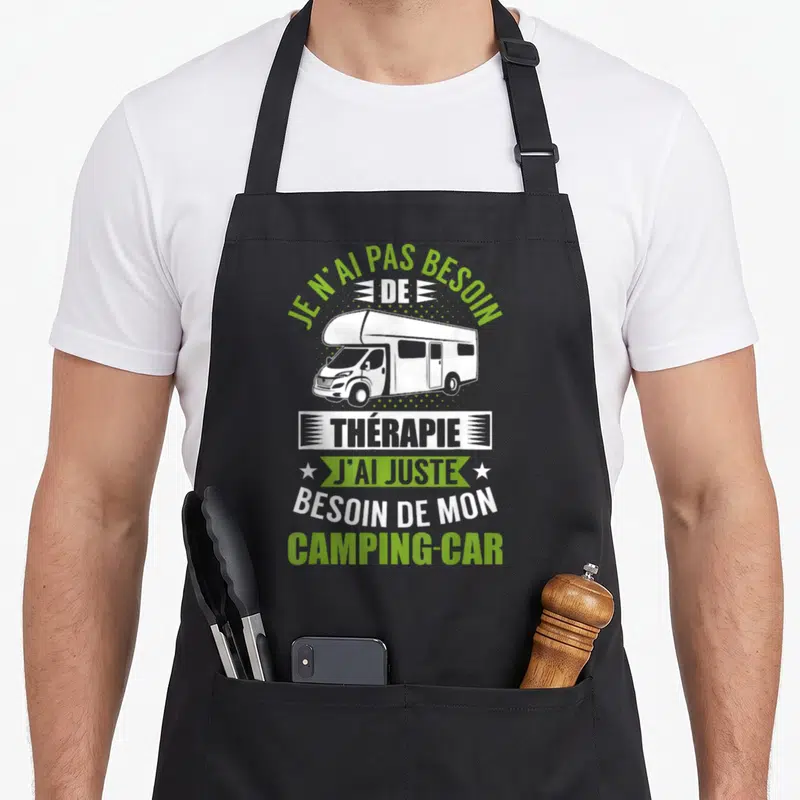 Tablier de cuisine noir avec illustration d'un camping-car blanc et texte vert et blanc