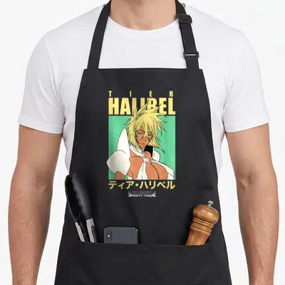 Tablier de cuisine noir avec illustration de Tier Harribel aux cheveux blonds sur fond vert et texte jaune.