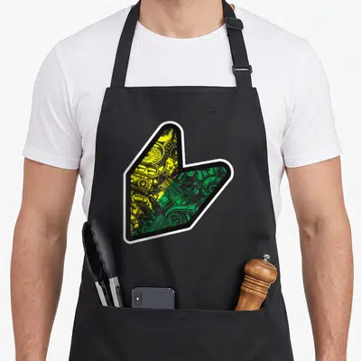 Tablier de cuisine noir avec un grand logo en forme de flèche contenant des schémas de moteur automobiles jaunes et verts.