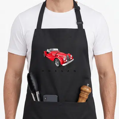 Tablier de cuisine noir avec illustration d'une Morgan rouge et du texte MORGAN en dessous.