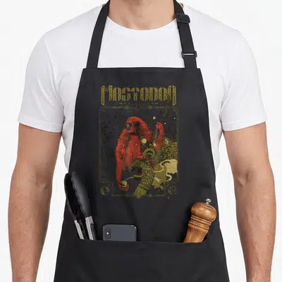 Tablier de cuisine noir avec illustration d'un mastodonte rouge tenant un trident doré et le texte Mastodon en haut.
