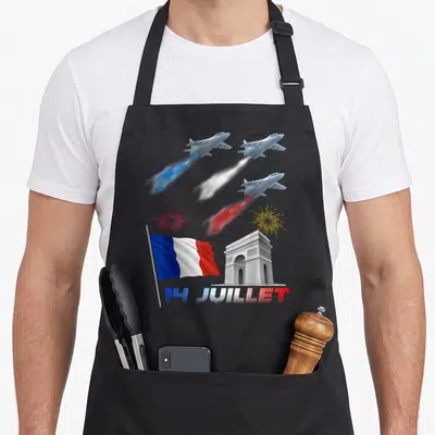 Tablier de cuisine noir avec drapeau français, Arc de Triomphe, avions et feux d'artifice aux couleurs bleue blanche et rouge.