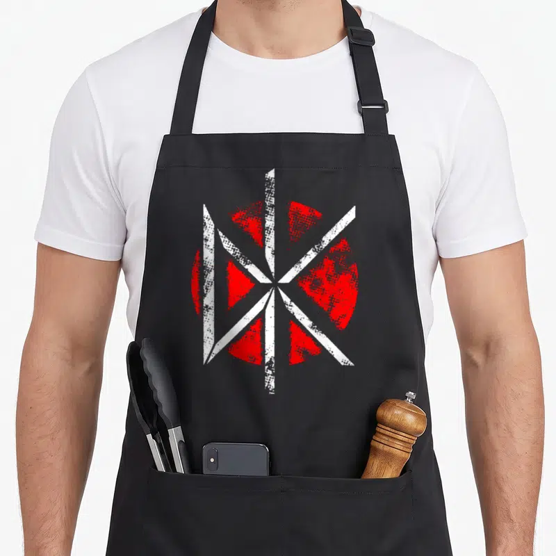 Tablier de cuisine noir avec un motif circulaire rouge et blanc aux lignes blanches croisées et effet granuleux.