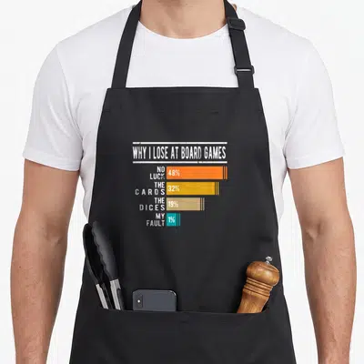 Tablier de cuisine noir avec un graphique coloré expliquant les raisons de ses défaites aux jeux de société.