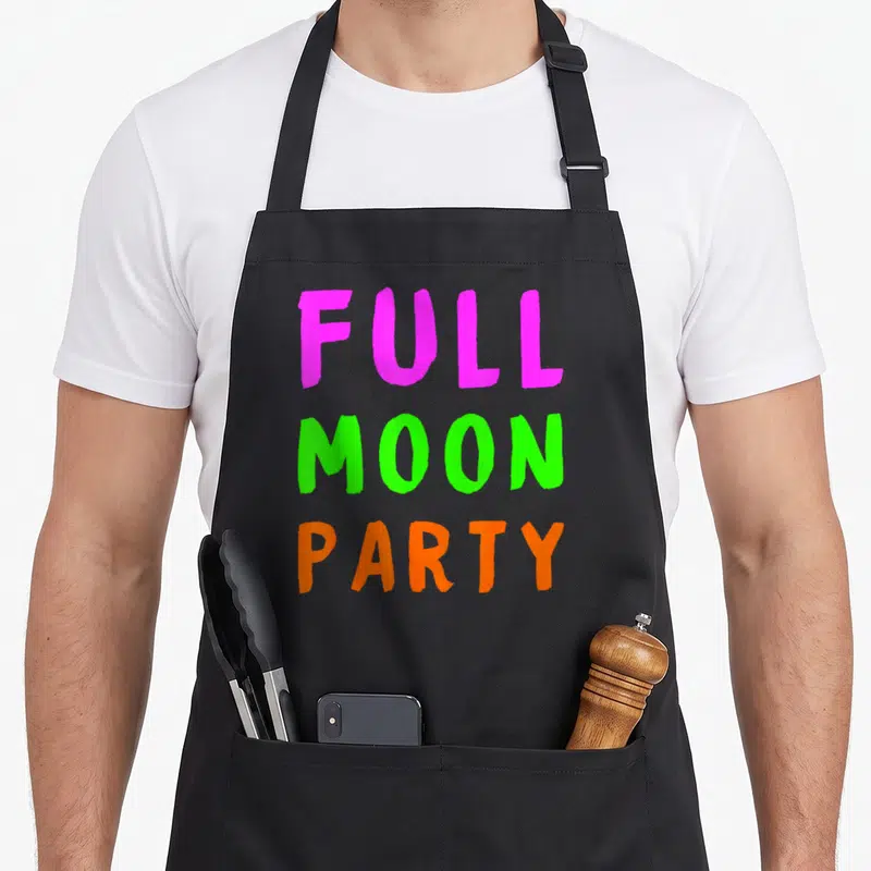 Tablier de cuisine noir avec texte Full Moon Party en rose vert et orange vif.