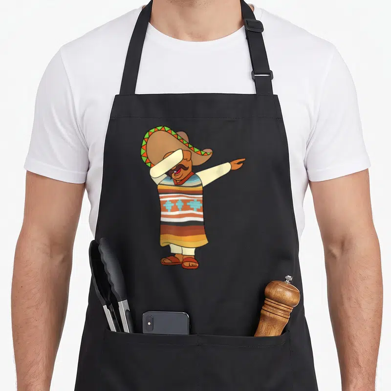 Tablier de cuisine noir avec illustration d'un homme en sombrero et poncho rayé faisant une pose dab.