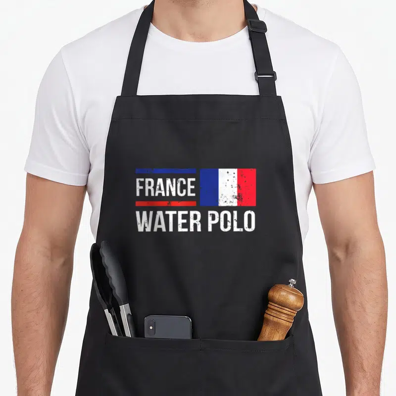 Tablier de cuisine noir avec un drapeau français et le texte France Water Polo en blanc délavé.