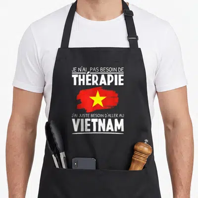 Tablier de cuisine noir avec inscription blanche et drapeau rouge étoile jaune du Vietnam imprimé sur le devant.