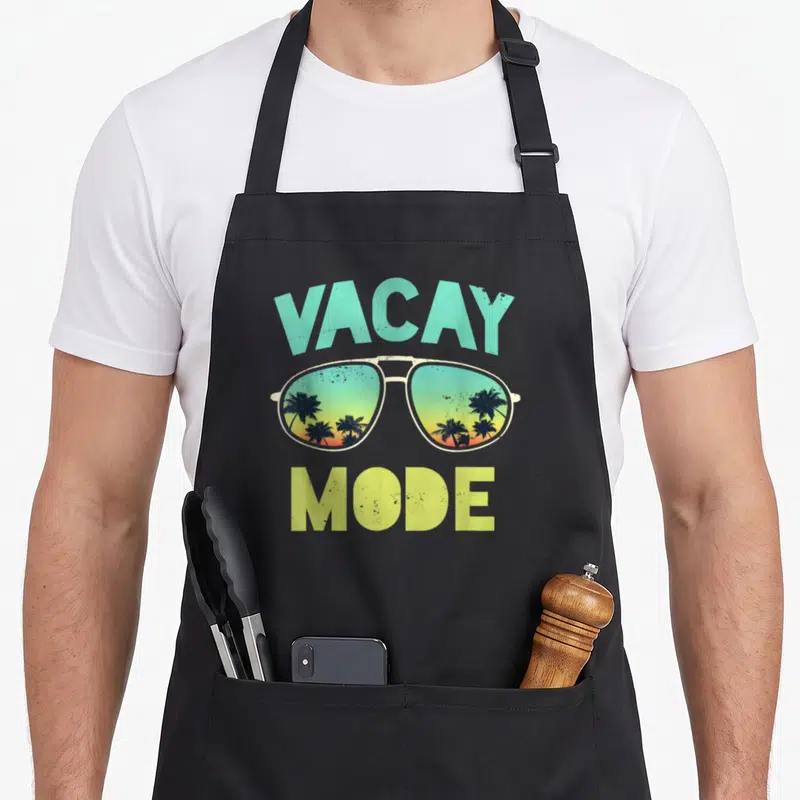 Tablier de cuisine noir avec lunettes soleil et texte Vacay Mode rétro coloré.