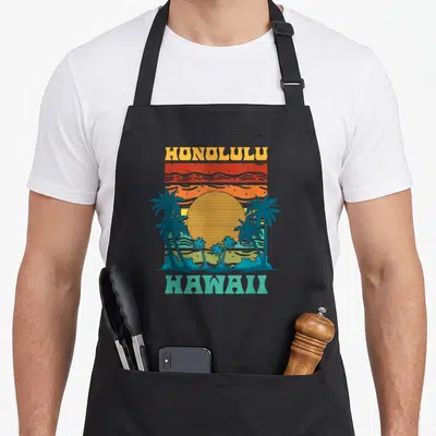 Tablier de cuisine noir avec illustration rétroHonolulu Hawaii palmiers et soleil orange