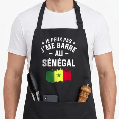 Tablier Je Peux Pas J'me Barre Au Sénégal Vacances — sur un tablier de cuisine noir, fond blanc