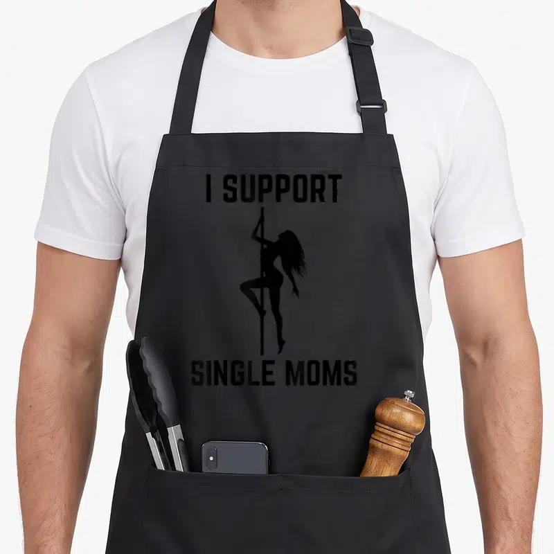 Tablier de cuisine noir avec silhouette femme sur tige et texte I Support Single Moms imprimé en noir.