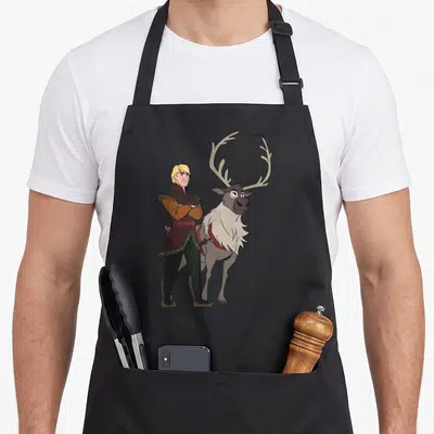 Tablier de cuisine noir avec l'illustration colorée de Kristoff et son renne Sven aux grands bois.