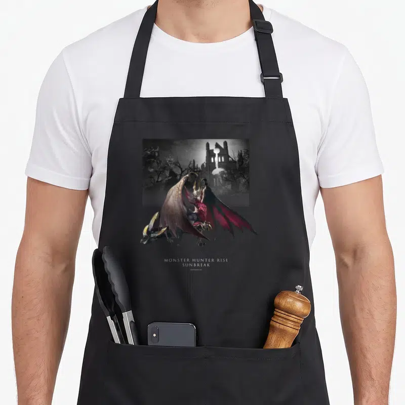 Tablier de cuisine noir avec illustration du monstre Malzeno et le titre Monster Hunter Rise Sunbreak en bas.